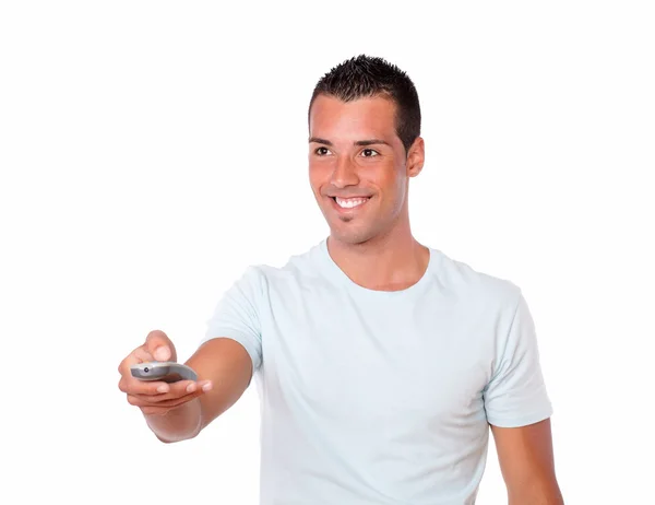 Latin man pointing with remote control — Stock Photo, Image