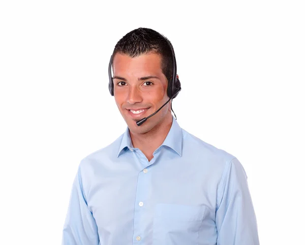 Cute young guy speaking with earphone — Stock Photo, Image
