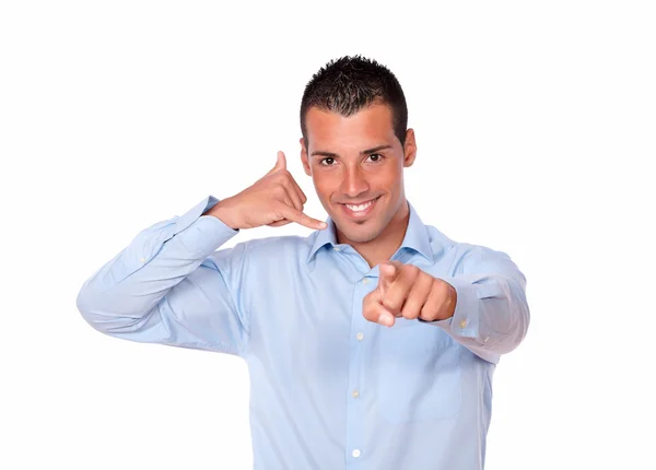 Cute hispanic guy with call gesture pointing — Stock Photo, Image