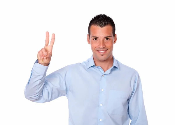 Cute young man with victory sign — Stock Photo, Image