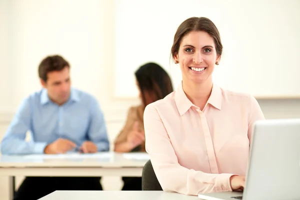 Young caucasian woman smiling at you — Stock Photo, Image