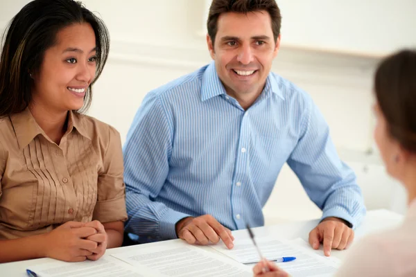 Young woman and man interested in a contract — Stock Photo, Image