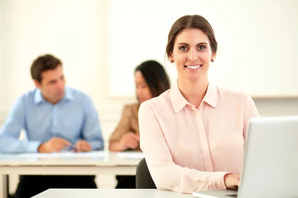 Lovely professional woman smiling at you Stock Image