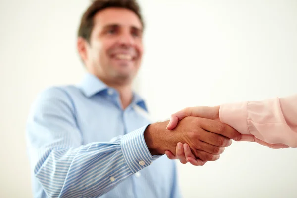 Adult charming businessman giving hands greeting — Stock Photo, Image