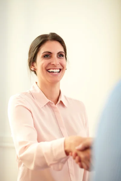 Adult charming businesswoman giving hands greeting — Stock Photo, Image