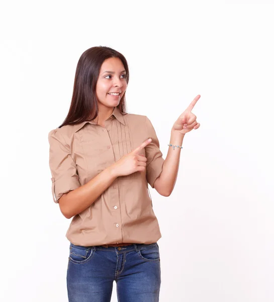 20s cute latin lady pointing to her left — Stock Photo, Image