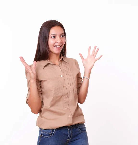 Surprised hispanic girl with brown blouse standing — Stock Photo, Image