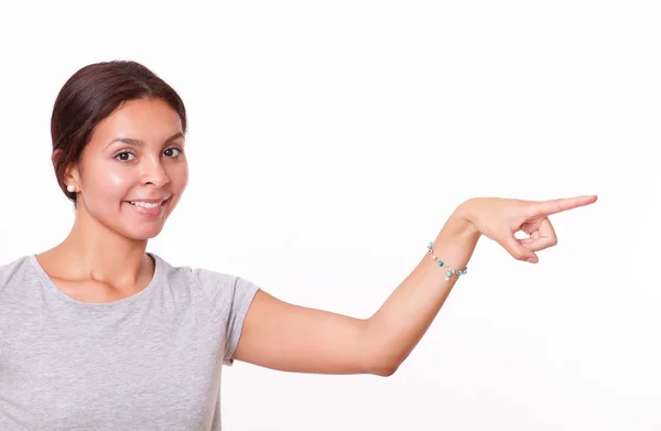 Girl pointing to her left — Stock Photo, Image