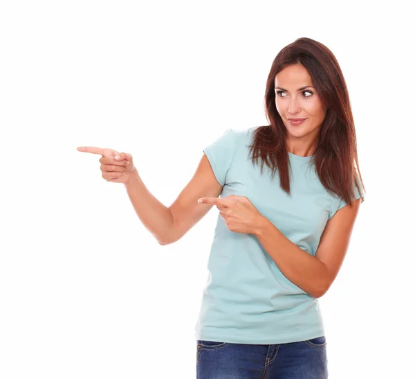 Sexy hispanic lady pointing to her right — Stock Photo, Image
