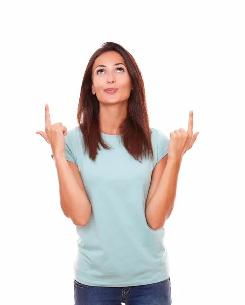 Pretty friendly woman pointing up her fingers — Stock Photo, Image