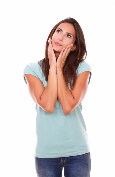 Pensive brunette with her hands on face — Stock Photo, Image