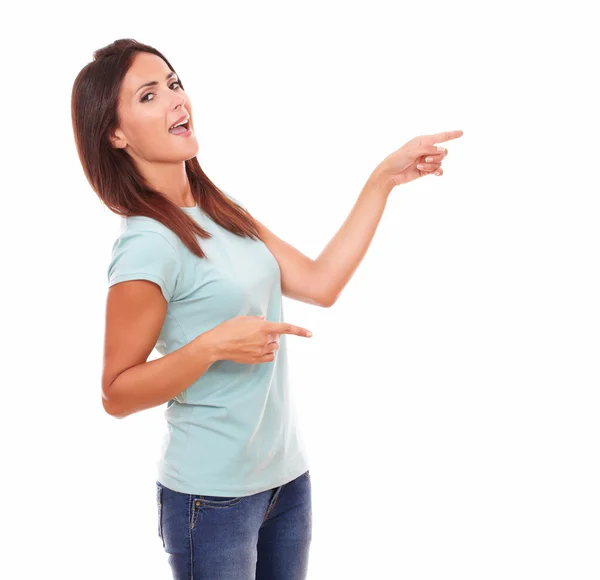 Sexy adult woman pointing to her left — Stock Photo, Image