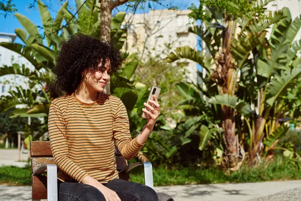 Cheerful Young Black Woman Taking Video Call While Sitting Chair — Stock Photo, Image