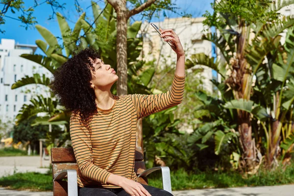 Attractive Young Black Woman Taking Selfie While Sitting Alone Chair — Stock Photo, Image