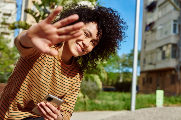 Smiling Young Black Woman Blocking Camera Her Hand While Sitting — Stock Photo, Image