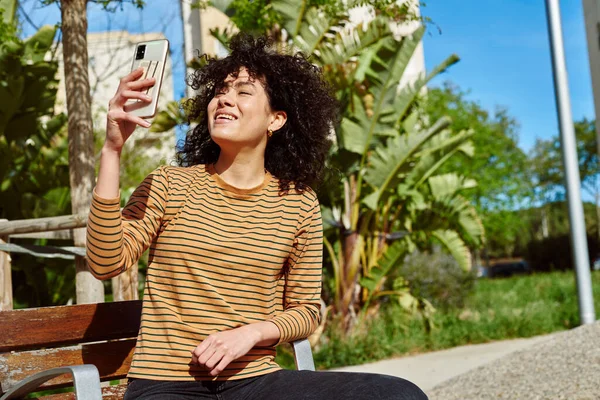 Happy Young Black Woman Taking Video Call While Sitting Alone — Stock Photo, Image