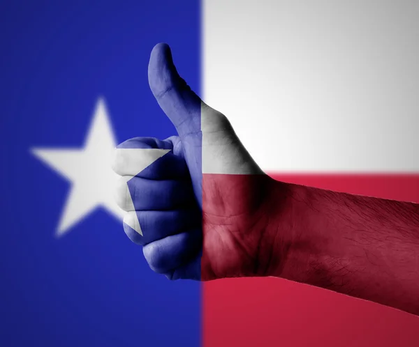 Ruka s palec nahoru pro texas — Stock fotografie