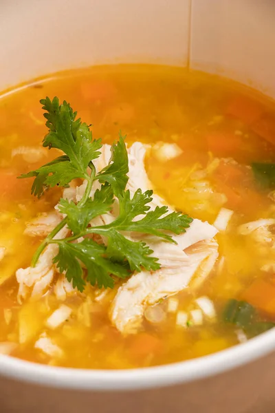 Detail of shredded chicken in Colombian soup with coriander