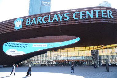 Brooklyn, NY; Circa 2022: Exterior view of Barclays Center entrance outside famous sports arena on bright morning day people walking on sidewalk past venue doors