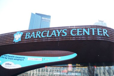Brooklyn, NY; Circa 2022: Exterior view of Barclays Center neon light sign outside famous sports arena on bright morning day. Host NETS basketball and Islanders Hockey, concerts and exhibitions.