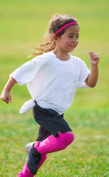 Excited Young Girl Running Peewee Soccer Field Learnings Playing Football Stockbild