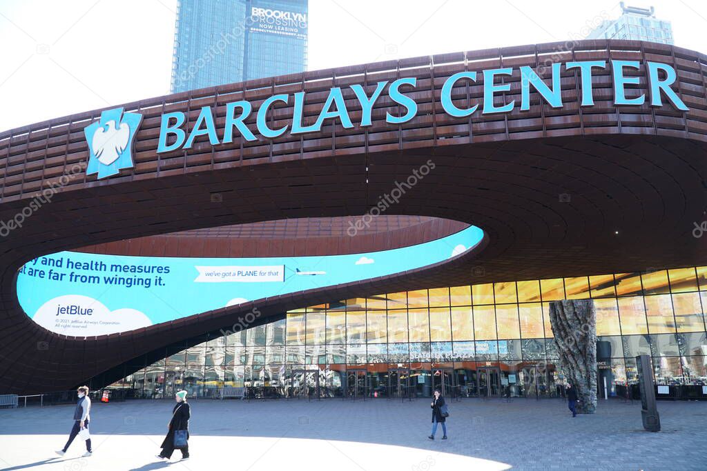 Brooklyn, NY; Circa 2022: Exterior view of Barclays Center entrance outside famous sports arena on bright morning day people walking on sidewalk past venue doors
