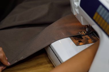sewing machine, seamstress hand fabric. High quality photo