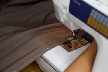 sewing machine, seamstress hand fabric. High quality photo