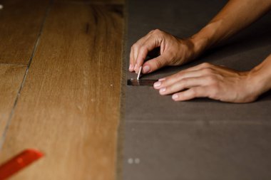 fabric marking hands ruler seamstress. High quality photo