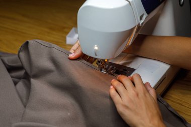 sewing machine, seamstress hand fabric. High quality photo