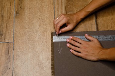 fabric marking hands ruler seamstress. High quality photo