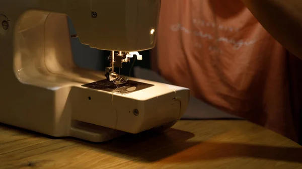 sewing machine, seamstress hand fabric. High quality photo