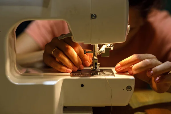 sewing machine, seamstress hand fabric. High quality photo