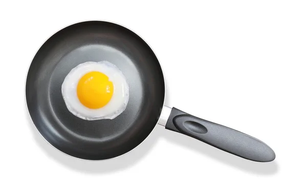 Frying pan with fried egg on white — Stockfoto