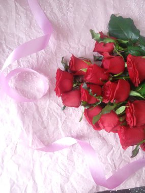 layout greeting card. beautiful bouquet of red roses and space for text.