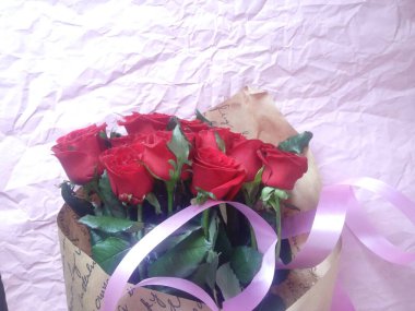 layout greeting card. beautiful bouquet of red roses and space for text.