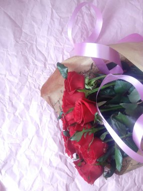 layout greeting card. beautiful bouquet of red roses and space for text.