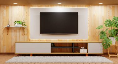 TV above wooden cabinet in modern empty room with plants carpet and downlight lamp on wooden background. Japanese style theme. Architecture and interior concept. 3D illustration rendering