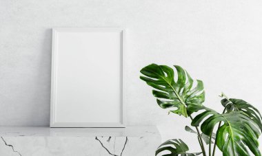Beyaz mermer masa üzerinde boş fotoğraf çerçevesi modeli. Beton arka planda İsviçre peyniri fabrikası önplanı var. Sanat ve iç dekorasyon konsepti. 3B illüstrasyon oluşturma