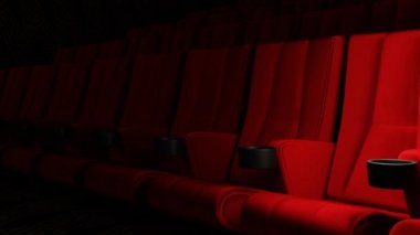Red velvet movie theatre cinema seat chairs with dolly tracking shot motion camera movement background. Art and entertainment concept.