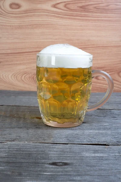 Glass of beer on wooden background — Stock Photo, Image