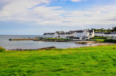 View of harbour and town Port Charlotte on Isle of Islay clipart