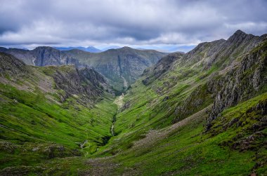 View of mountains in Glen Coe valley, Scotland clipart
