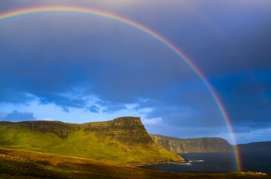 Rainbow over a dramatic coast of Scottish highlands, Isle of Sky clipart