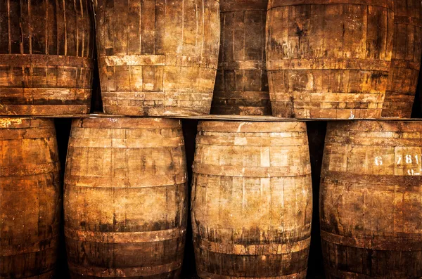 Stacked whisky barrels in vintage style — Stock Photo, Image