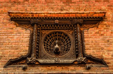 Detail of carved peacock window in Bhaktapur, Nepal clipart