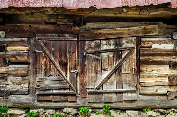 Dettaglio di vecchia porta in legno testurizzato e stagno intemperie — Foto Stock