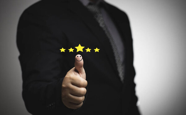 Business people thumb up positive thinking score a list of smile and stars for satisfaction on mobile service, online transactions, network performance, customer satisfaction.