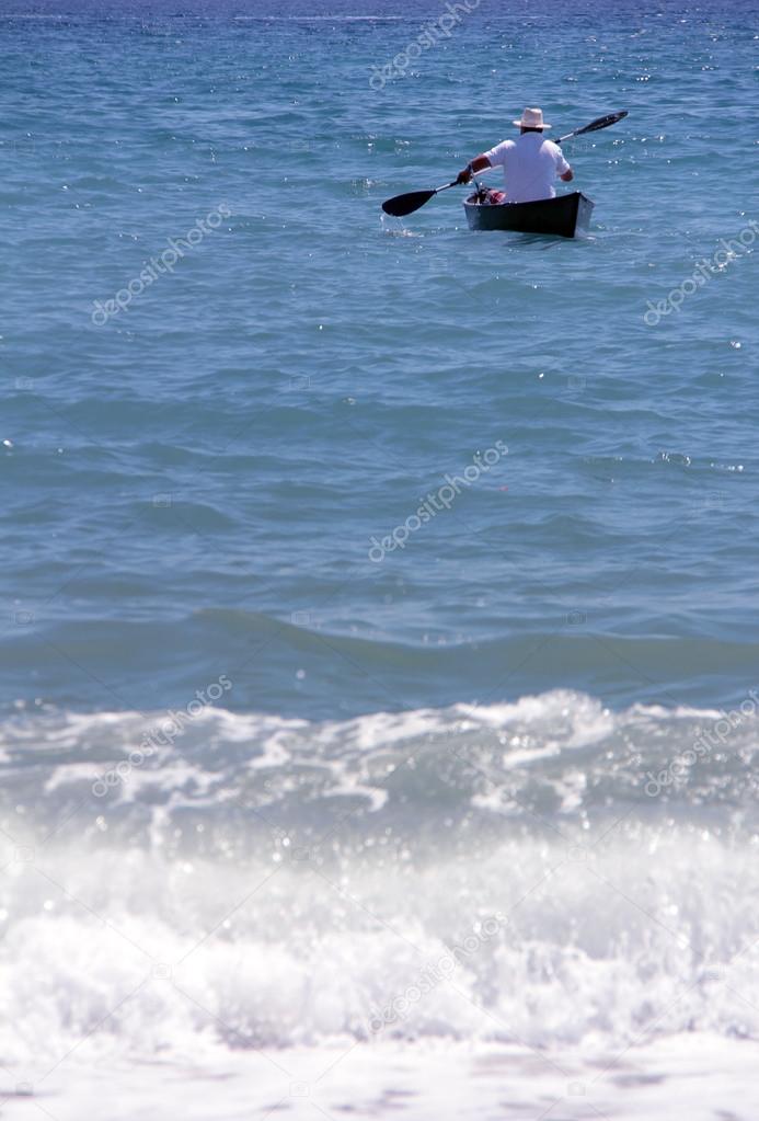 lonely man with rowing boat