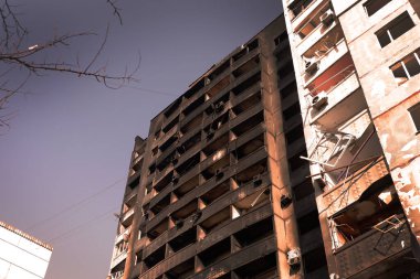A destroyed high-rise building with people in Kharkov after the shelling of Russian troops. War of Russia against Ukraine.